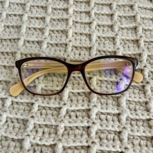 Oliver Peoples brown and cream frame glssses.